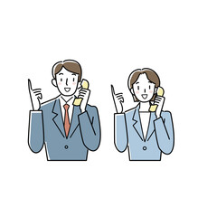 指さしポーズで電話をするスーツの男女