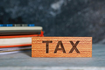 Tax word on wooden block with copy space for your text