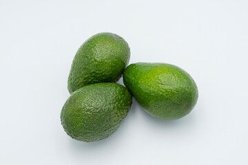 Fresh ripe green avocado on white background