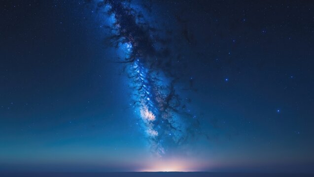 Stunning expanse of a blue night sky filled with stars and the Milky Way galaxy. Concepts of astronomy, perspective, and a clear sky background.