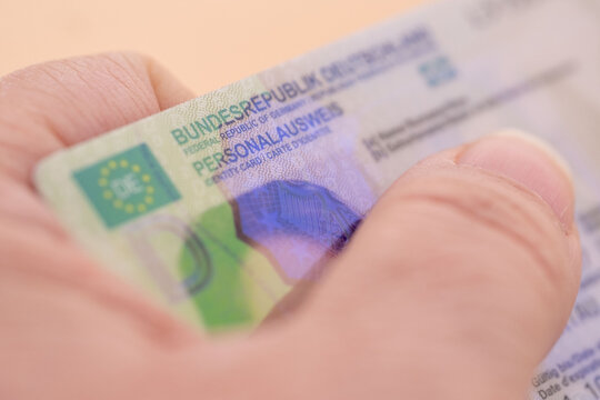 German identity card, document, concept obtaining German citizenship, migration law, passport control border, foreign travel, obtaining visa, Frankfurt - January, 29, 2025