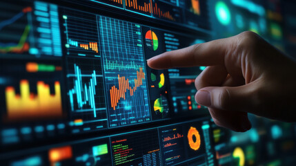Close-up of a hand pointing at stock market data on a digital screen
