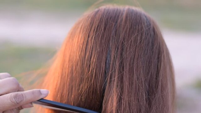 Asian woman's gray hair, Grey color hair of Asian, Regrown gray roots of dyed hair on head of woman, Dry and damaged hair