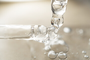 samples serum tests glass pipettes with drops of serum on a light beige background