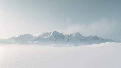 Mountains draped in snow against a serene white landscape
