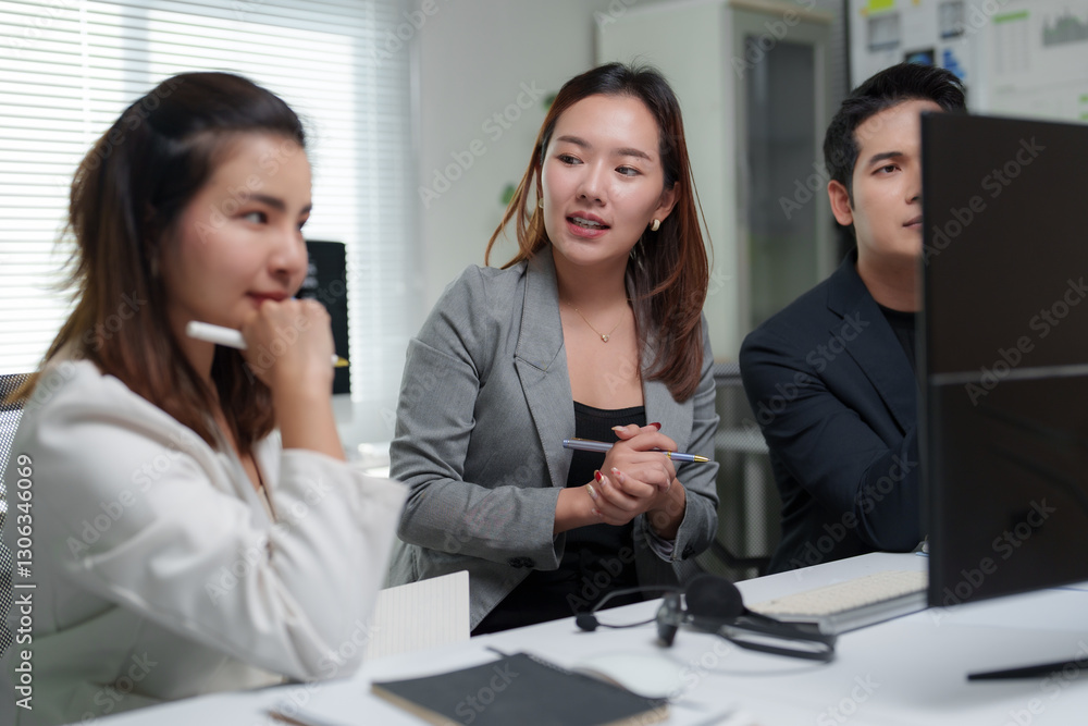 Poster business team discussing work and analyzing financial data on computer in office
