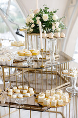 Delicious desserts decorating a wedding reception table