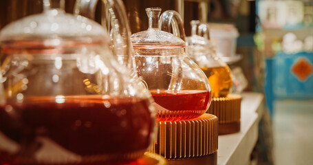 Chengdu, Sichuan, China. Kettle Tea. Sale Of Chinese Berry Flower Tea. Fruit Flower Tea. Asian Cuisine. Glass Teapot. brewed Tea for delicious and healthy beverage