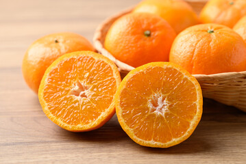 Mandarin tangerine orange fruit on wooden background