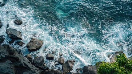 Powerful ocean waves crashing against jagged rocks.
