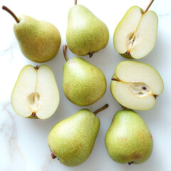 Whole green pears are beautifully displayed alongside their sliced halves, showcasing the vibrant green skin and juicy interior. This setup invites a focus on healthful snacking and fresh flavors