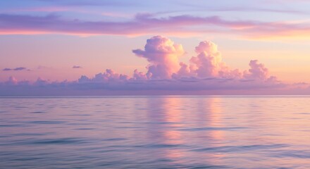 Naklejka premium A dreamy pastel sunset over a calm ocean with soft waves and glowing clouds