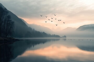 serene lakeside at sunrise exhibiting the silhouettes of early birds in the sky
