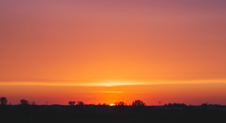 Naklejka premium A 70s retro sunset with a gradient of warm orange and pink hues