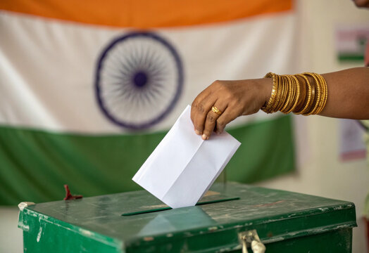 indian woman casting vote close up