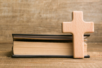 holy book of christians bible and wooden cross.Concepts of religion and faith in god