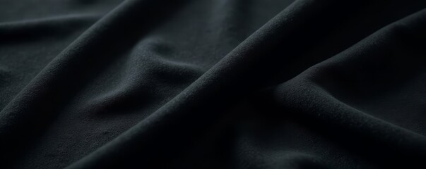 Fototapeta premium Deep black suede, soft nap, subtle light variations, high-resolution, luxurious background