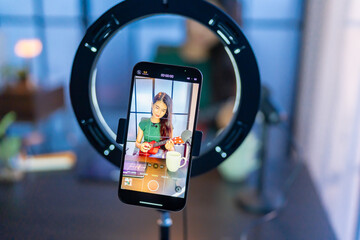 Content creator Young asian woman influencer creating content in home studio entertainment and...