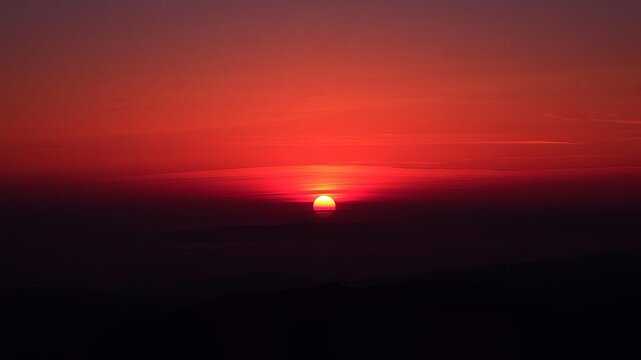 Crimson moonrise over misty mountain peaks at sunset, moonrise, silhouette