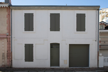 grey green wooden front door shutter of street restored house entrance classic french home