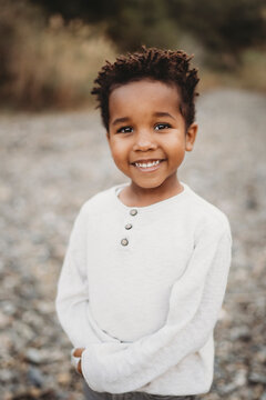 Portrait beautiful black 5 year old boy  smiling outside in sumer