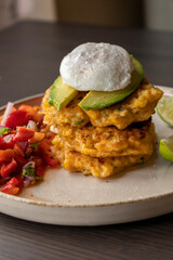  delicious corn fritters with salsa and poached egg – the perfect brunch