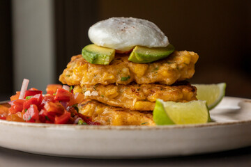  delicious corn fritters with salsa and poached egg – the perfect brunch