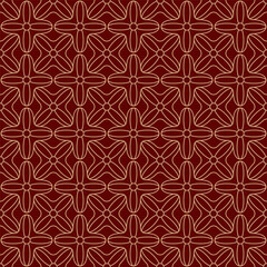 Seamless gold ornament on a red background. The composition of colorful elements creates a seamless pattern. 