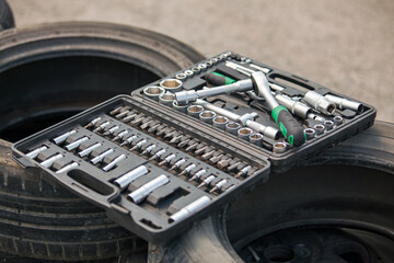 Set of tools on the car wheel. Close-up shot.