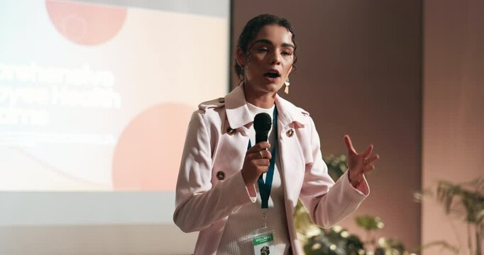 Seminar, speaker and businesswoman on stage with presentation on leadership development in office. Mic, public speaking and female hr director with pitch at corporate conference, event or workshop.