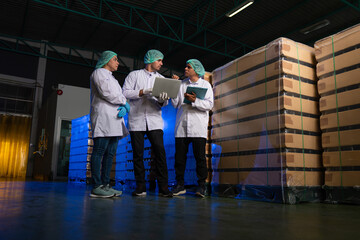 Team of worker quality control a fruit drink factory in glass bottles