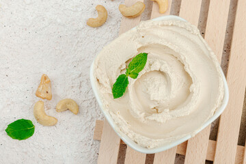 Homemade vegan cashew cheese. Raw healthy sauce in a bowl, lactose free food. Bio organic product