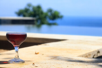 A glass of red wine is a beautiful background for serving