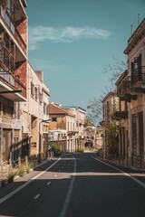 Obraz premium Deserted urban street with vintage buildings.