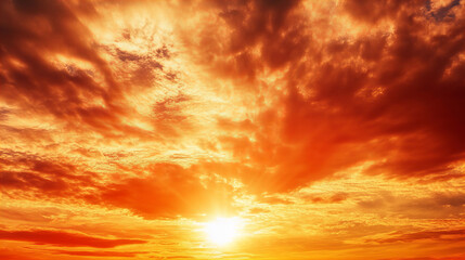 Obraz premium Stunning golden sunset sky with dramatic orange clouds and sun rays shining through, creating a warm atmospheric scene perfect for backgrounds, nature themes, and inspirational designs.