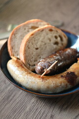 Traditional Czech dish featuring Masopust-style blood sausage (jelito) and white sausage (jitrnice), served with fresh rustic bread. 