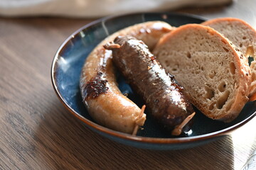 Traditional Czech dish featuring Masopust-style blood sausage (jelito) and white sausage (jitrnice), served with fresh rustic bread. 