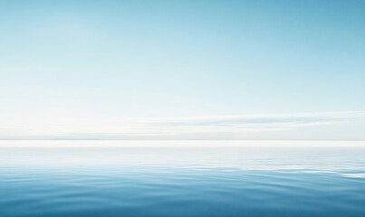 Obraz premium Calm Blue Ocean Water Ripples Under a Soft, Muted Sky Landscape