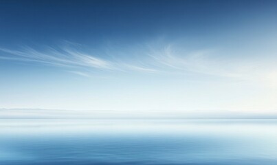 Obraz premium Calm Water and Blue Sky with Wispy Clouds Creating a Serene Scene