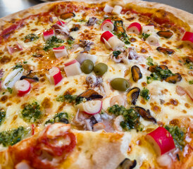 Whole Baked Seafood Pizza with Surimi, Olives, Mussels, and Cheese