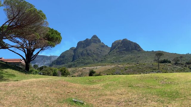 Devil&rsquo;s Peak as viewed from the campus of University of Cape Town on a cloudless, windless summer afternoon.