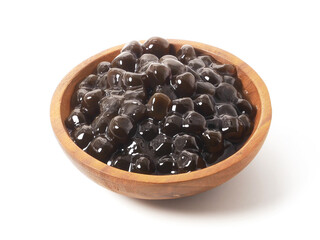 Brown sugar pearls bubble in wooden bowl isolated on white background