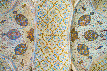 Ceiling paintings in one of the halls of the Ali Qapu Palace, Isfahan, Iran. An example of Persian...