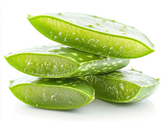 Fresh Aloe Vera leaves stacked on a white background