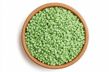 Green candy sprinkles in wooden bowl