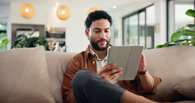 Relax, tablet and thinking with man on sofa in home living room for app browsing or social media. Idea, planning and vision with happy person in apartment for break, connectivity or internet search