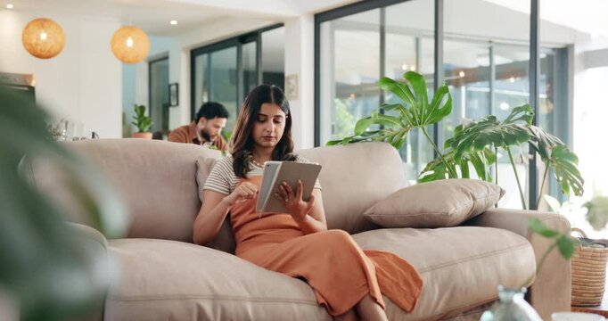 Typing, search and tablet with woman on sofa for social media post, reading or online update. Networking, newsletter subscription and connection with person in living room at home for chat and scroll