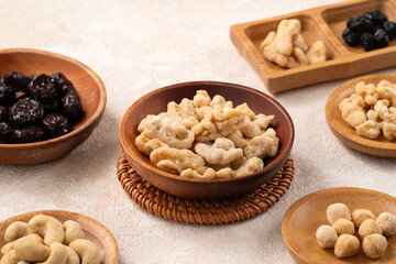 Flavored mixed nuts in bowls.