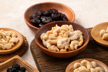 Flavored mixed nuts in bowls.