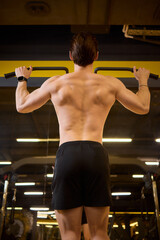 An Athlete Executing Pullup in a Gym Environment, Showcasing Their Physical Abilities
